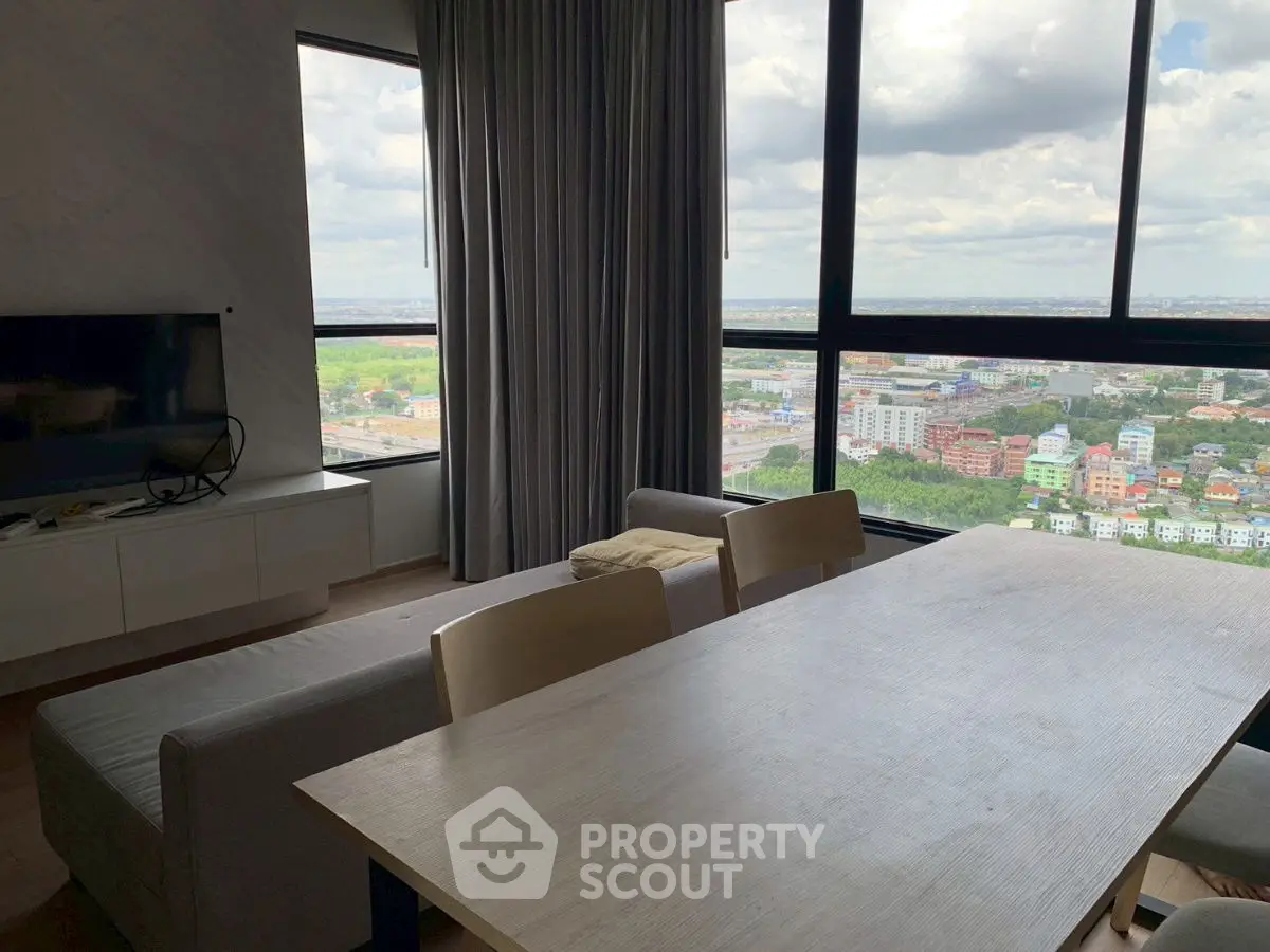 Modern living room with panoramic city view and stylish furniture