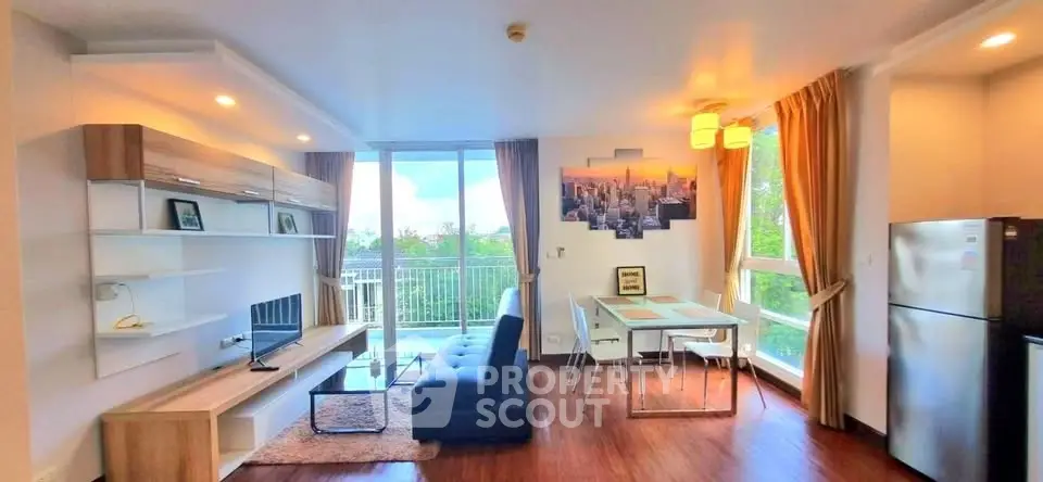 Modern living room with balcony view and stylish dining area