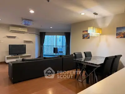 Spacious modern living room with balcony view and elegant dining area.