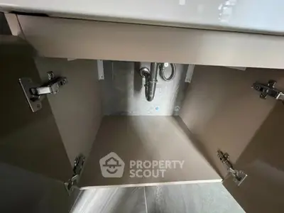 Modern under-sink cabinet with sleek design and ample storage space.