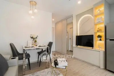 Modern living room with elegant decor and open layout, featuring a stylish dining area and cozy ambiance.