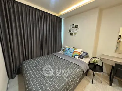 Cozy bedroom with modern decor and ample natural light