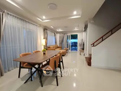 Spacious modern living room with dining area and elegant decor