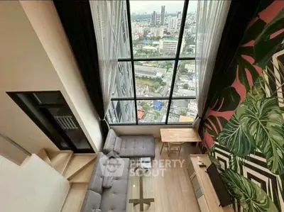 Stunning high-rise living room with floor-to-ceiling windows and city view, featuring modern decor and cozy seating.
