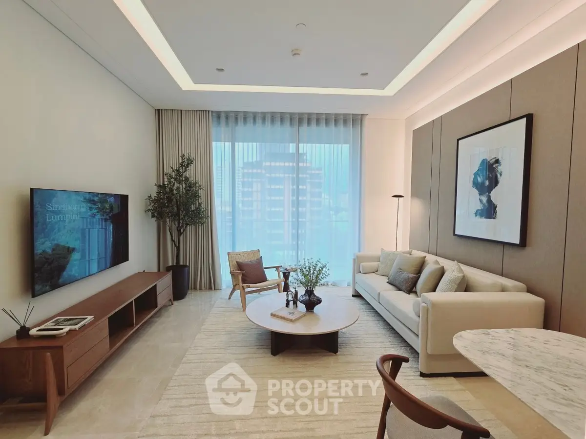 Luxurious modern living room with elegant decor and large window view.