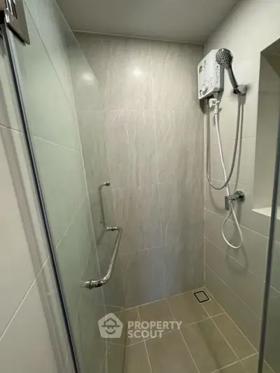 Modern bathroom with sleek shower design and water heater