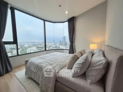 Luxurious bedroom with panoramic city view and elegant decor
