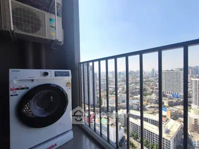 High-rise balcony with city view and washing machine, perfect urban living.
