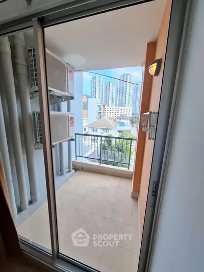 Charming balcony with city view, perfect for relaxation and enjoying urban living.