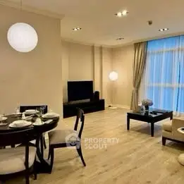 Spacious living room with elegant dining area and modern decor