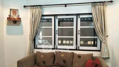 Cozy living room with elegant curtains and comfortable sofa