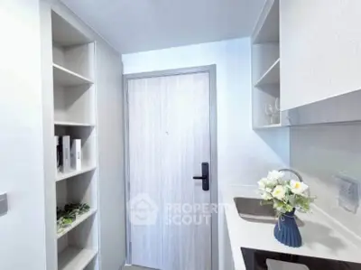 Modern kitchen with sleek cabinetry and elegant decor in a compact space