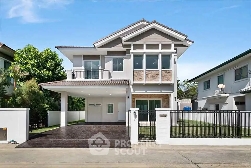 Stunning modern two-story house with spacious driveway and elegant facade in a serene neighborhood.