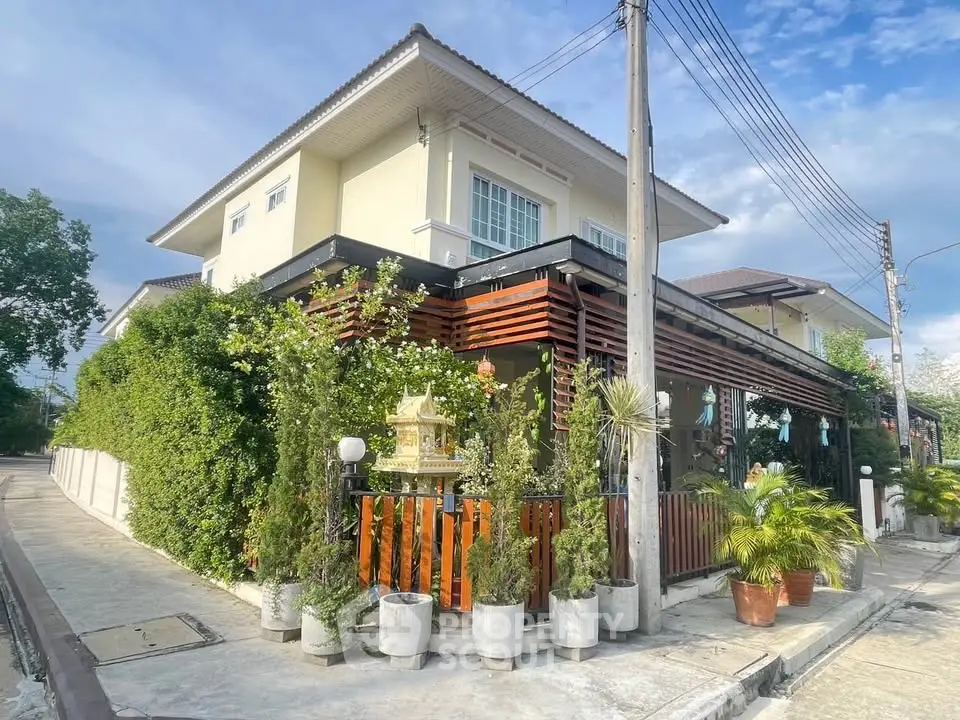 Charming corner house with lush greenery and modern design in a serene neighborhood.