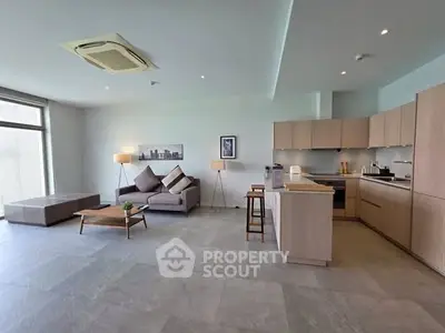 Spacious modern living room with open kitchen and stylish decor