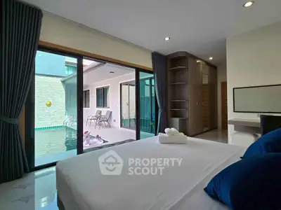 Luxurious bedroom with pool view and modern interior design
