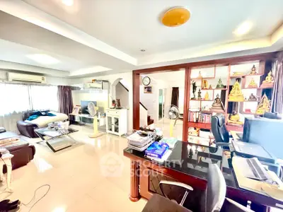 Spacious living room with home office and elegant decor