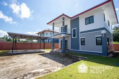 Modern two-story house with spacious driveway and lush green lawn