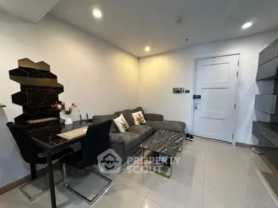 Modern living room with stylish decor and cozy seating area, perfect for relaxation and entertaining guests.