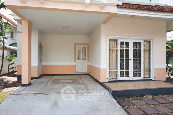 Charming suburban home with spacious carport and inviting entrance.