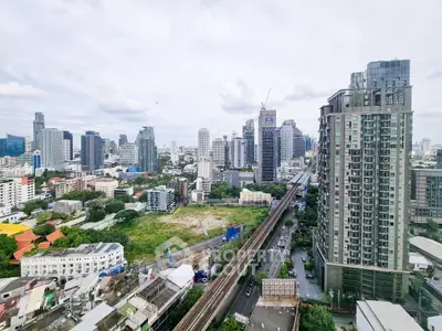 Stunning cityscape view with modern high-rise buildings and lush greenery, perfect for urban living.