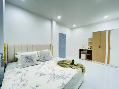 Spacious modern bedroom with elegant decor and ample storage space