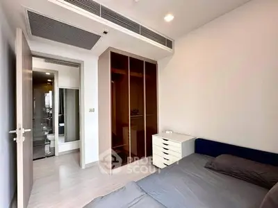 Modern bedroom with built-in wardrobe and sleek design