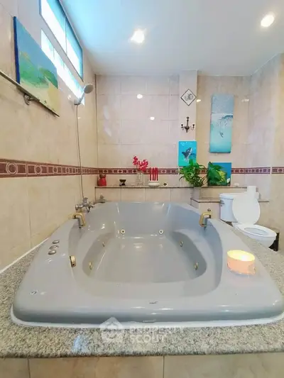 Luxurious bathroom with large bathtub and elegant decor