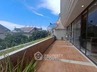 Spacious balcony with scenic view and modern amenities in urban setting