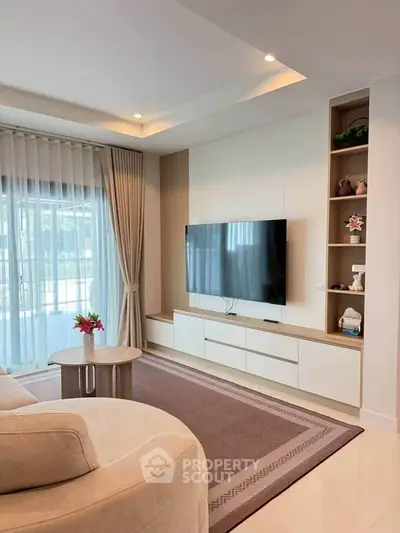 Modern living room with sleek TV setup and elegant decor