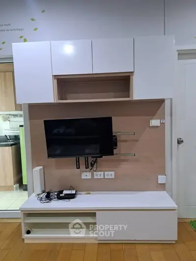 Modern living room with sleek TV unit and stylish cabinetry, perfect for contemporary home decor.