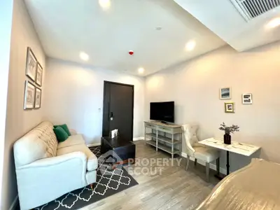 Modern living room with stylish decor and cozy seating area, perfect for relaxation and entertainment.
