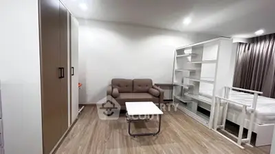 Spacious studio apartment with modern furnishings and ample storage space.