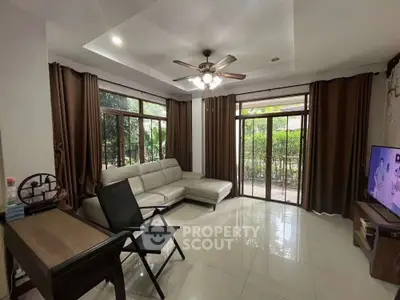 Spacious living room with modern decor and garden view