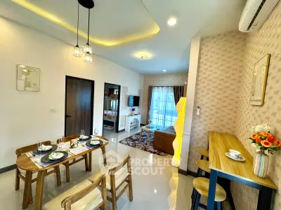 Modern open-plan living and dining area with stylish decor and natural light.
