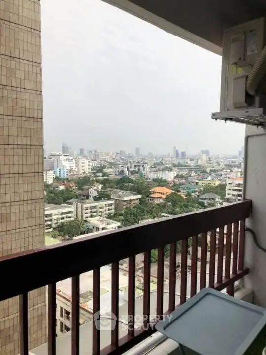 Stunning cityscape view from high-rise balcony with expansive skyline.