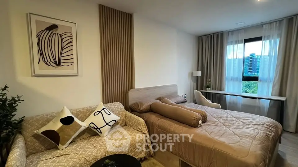 Cozy bedroom with stylish decor and large window view