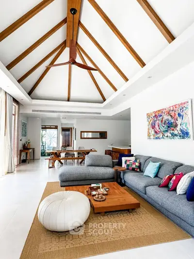 Spacious living room with vaulted ceiling and modern decor