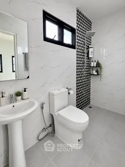 Modern bathroom with sleek fixtures and stylish tile design