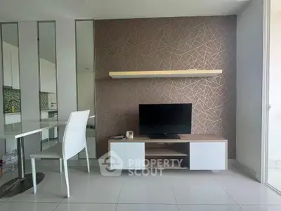 Modern living room with sleek TV stand and geometric accent wall