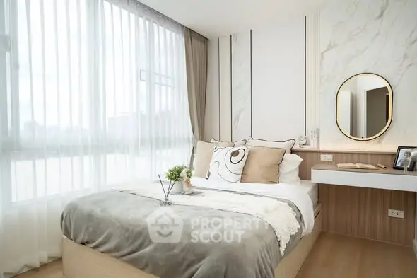 Modern bedroom with elegant decor and natural light