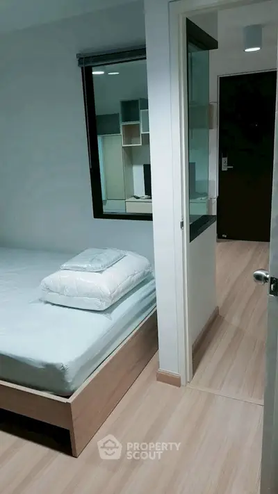 Modern bedroom with minimalist design and wooden flooring