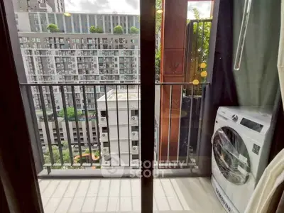 Modern balcony with washing machine and city view, perfect for urban living.