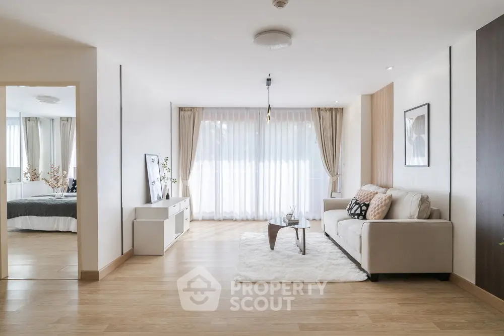 Spacious modern living room with natural light and elegant decor