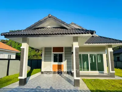 Charming modern single-story house with tiled roof and spacious front yard.