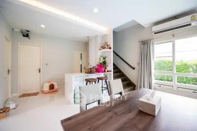 Modern open-plan living area with stylish kitchen and dining space