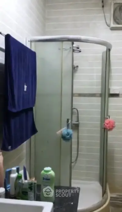 Compact bathroom with shower enclosure and modern fixtures