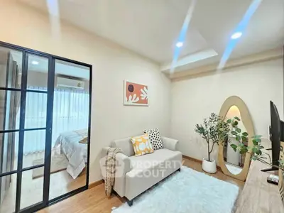 Chic modern living room with cozy decor and bedroom view