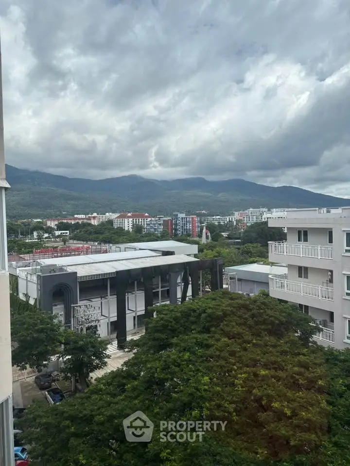 Scenic urban view with mountains and modern buildings