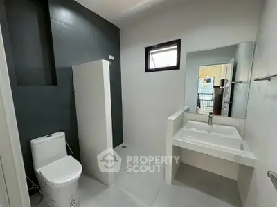 Modern minimalist bathroom with sleek fixtures and neutral tones